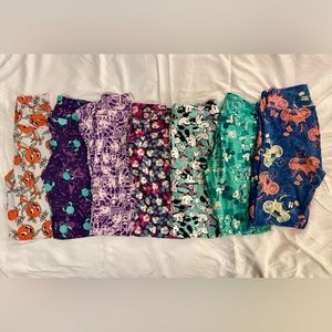 Lot of Lularoe Disney leggings (one size) and one pair of Orange Bird.